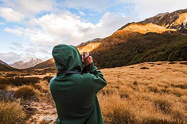 Guy at with camera, Selwyn, Canterbury, South Island, New Zealand, Oceania