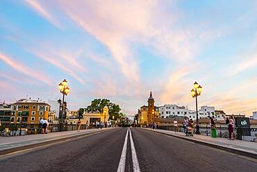 Bridge Puente de Triana, view in direction of the district Triana, sunset, Sevilla, Andalusia, Spain, Europe