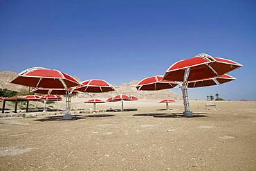 Abandoned parasols on the beach, Dead Sea, En Gedi, Negev desert, Israel, Asia