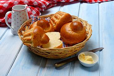 Brioche, brioches in basket and dish with butter, Germany, Europe