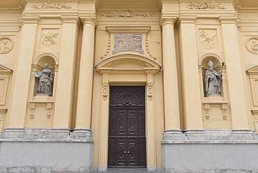 Two sculptures of saints on the main facade of the Theatine Church, Munich, Bavaria, Germany, Europe