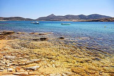 Golden shimmering beach in Antiparos with view of Despotiko, Antiparos, Cyclades, Greece, Europe