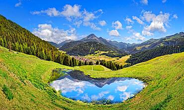 Alpine meadow with small lake and reflection, Partischalm, Nauders, Tyrol, Austria, Europe