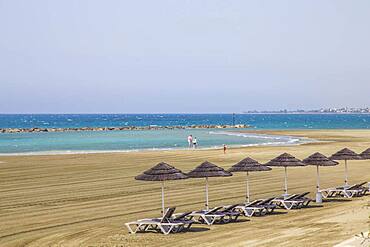 Deck chairs, straw umbrellas, empty beach, Robinson Club Cyprus, Alaminos, Cyprus, Europe