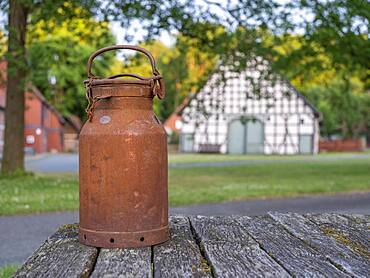 Old milk can in the village center of the Rundlingsdorf Luebeln, county Luechow-Dannenberg, Wendland, Lower Saxony, Germany, Europe