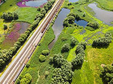 Drone image of railway tracks and wetland near Klein Ilsede, Ilsede, Peine district, Lower Saxony, Germany, Europe