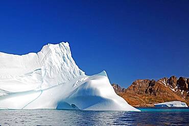 Smooth icebergs, Barren mountains, Summer, Arctic, Tasilaq, Greenland, Denmark, North America