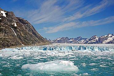 Pieces of ice in front of glacier, barren mountains, Knud Rasmussen Glacier, Tasilaq, Greenland, Denmark, North America