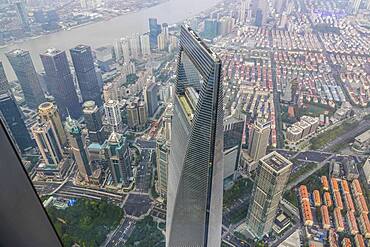 View from the highest observatory of the world on 562 meters height in the 632 meters high skyscraper Shanghai Tower to the special economic zone Pudong with the 492 meters high Shanghai World Financial Center, nicknamed The Bottle Opener, Shanghai, People's Republic of China