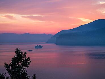 Ship at anchor, dawn in front of sunrise, Gulf of Sorrento, Calabria, Italy, Europe