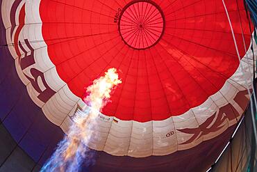 Hot air balloon, balloon flight, view into the balloon envelope during heating up