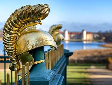 Restored fence with gold helmets at the Lake Grienerick obelisk in Rheinsberg, Rheinsberg, Brandenburg, Germany, Europe