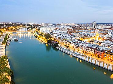 Aerial view of historic part with the river in Seville by the evening, Spain, Europe