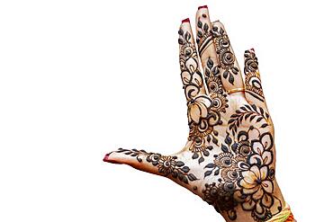 Hand of Hindu bride painted with hennas isolated on white background, Mauritius, Africa