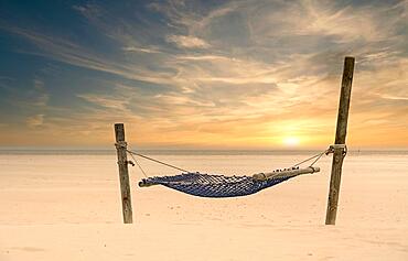 Hammock in the sunset at the North Sea, Amrum, Germany, Europe