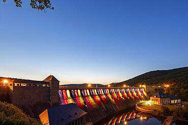 Illuminated dam wall in the evening twilight, Edersee, Ederstausee, Edertalsperre, behind Schloss Waldeck, Hesse, Germany, Europe