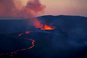 Glowing lava fountains, flowing partly down mountainside, dusk, Fagradalsfjall, Reykjanes, Grindavik, Iceland, Europe