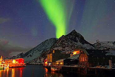 Small harbour with illuminated houses, aurora borealis, Nyksund, Nordland, Vesteralen, Scandinavia, Norway, Europe