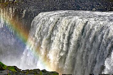 Rainbow and water masses of a waterfall, Dettifoss, Joekulsa a Fjoellum, Iceland, Europe