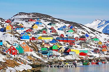 Houses in different colours, snow landscape and small boats, Kaangamuit, West Greenland, Greenland, Arctic, Denmark, North America