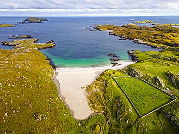 Aerial of white sand and turquoise water at Bosta Beach, Isle of Lewis, Outer Hebrides, Scotland, UK