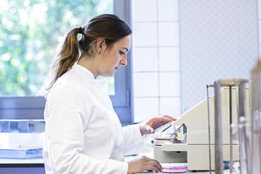 Laboratory examination with laboratory assistant in an examination laboratory for food control, Freiburg, Baden-Wuerttemberg, Germany, Europe