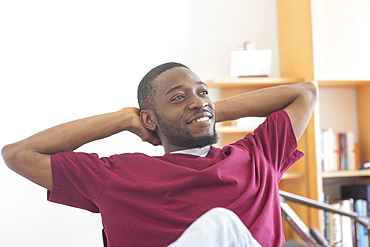 Young black man reconsiders a vision or innovation in the office, Freiburg, Baden-Wuerttemberg, Germany, Europe