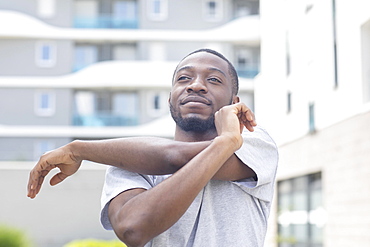 Young black man doing fitness in the summer of the city, Freiburg, Baden-Wuerttemberg, Germany, Europe