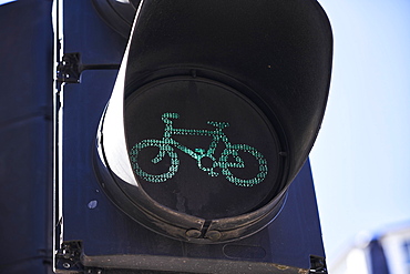 Green traffic light cyclist, London, England, United Kingdom, Europe