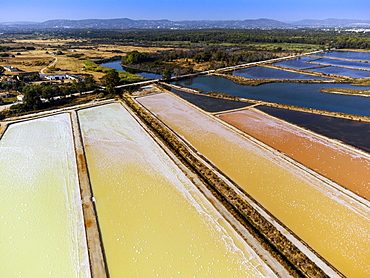 Amazing colors of sea salt ponds called salines shortly before salt extraction in Portugal