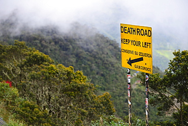 Left-hand traffic sign on the road of death, Camino de la Muerte, La Paz Department, Bolivia, South America