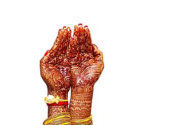 Indian Bride's hand painted with mehndi isolated on white background. Mauritius