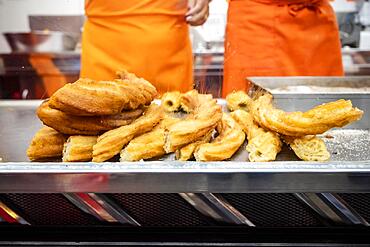 Traditional Iberian tasty sweets called fartura ready to sell at Santa Iria festival in Faro, Algarve, Portugal, Europe