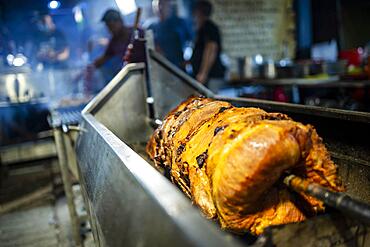 Piglet roasted on charcoal during Santa Iria Festival, Faro, Algarve, Portugal, Europe