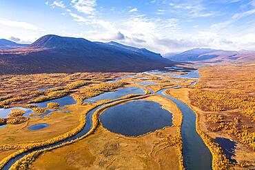 Autumn landscape with river, lakes and mountains, Visttasjohka river course, Visttasvaggi valley, Nikkaluokta, Lapland, Sweden, Europe