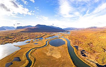 Autumn landscape with river, lakes and mountains, Visttasjohka river course, Visttasvaggi valley, Nikkaluokta, Lapland, Sweden, Europe