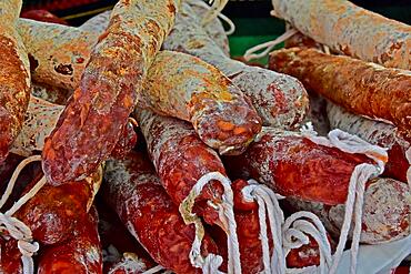 Several hard sausages in display, butcher's shop, sausage (salsicha), Spanish tradition, sausage with suspension, sausage with suspension string, ingredients of muscle meat, bacon, salt and spices, sausage recipe