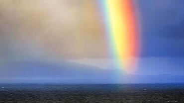 Bright rainbow in haze, evening sky, Acaill coast, Achill Island, Mayo, Ireland, Europe