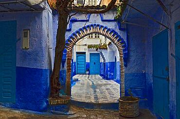 Moorish round archway and blue wall in front of house entrance, Blue City, Chefchaouen, Tangier-Tetouan-Al Hoceima, Morocco, Africa