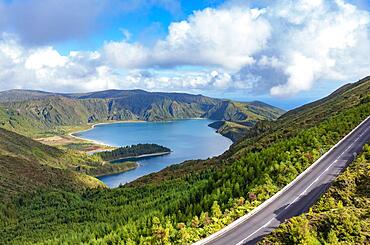 Drone shot, mountain road to the summit of Pico da Barrosa and view to the crater lake Lagoa do Fogo, Sao Miguel Island, Azores, Portugal, Europe