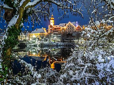 Christmas illuminated house facade of Frohnleiten reflected in the river Mur, Frohnleiten, Styria, Austria, Europe