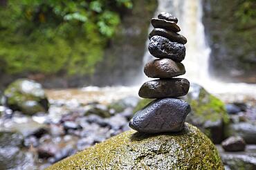 Cairns at the Salto do Prego waterfall, Faial da Terra, Sao Miguel, Azores, Portugal, Europe