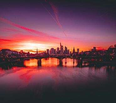 Pink sunset over the river Main, illuminated skyline of the city of Frankfurt am Main, Hesse, Germany, Europe