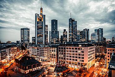 The Hauptwache, view from above onto a square with shops and restaurants, in the background the skyline Illuminated in the evening, Frankfurt, Hesse, Germany, Europe