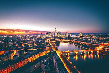 View over Frankfurt, view into the sunset with backlight, in the evening, the river Main and the skyline with its skyscrapers and streets taken from the Lindner Hotel, Hesse, Germany, Europe