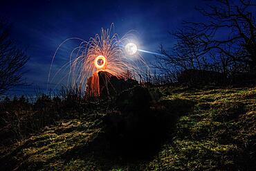 View at night to the moon, on the slate rock Grossen Feldberg in Taunus, steel wool photography is made, Hesse, Germany, Europe