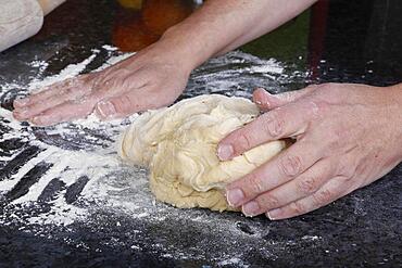 Swabian cuisine, baking, preparing yeast yeast dough, flour, men's hands, Germany, Europe