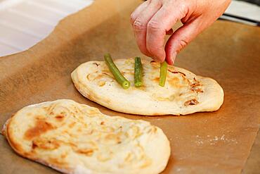 Swabian cuisine, preparation Hohenloher Blootz, Blooz, salty yeast pastry, green beans, man's hand, Germany, Europe