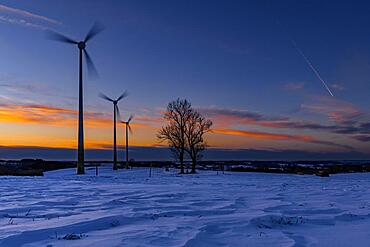 Wind turbines at blue hour in winter landscape, Ronsberg, Ostallgaeu, Bavaria, Germany, Europe