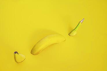 Sliced banana on a yellow background